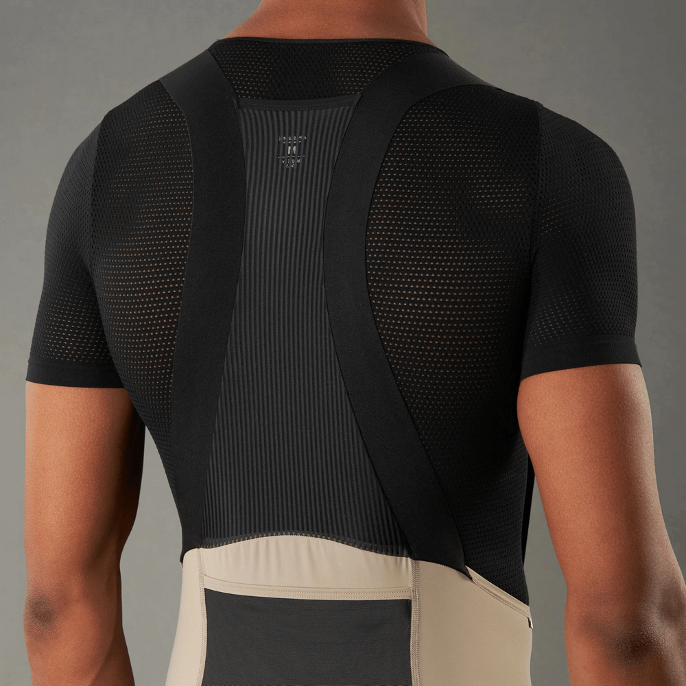 Back view of men's cycling bib shorts with breathable fabric and ergonomic design for comfort and performance.