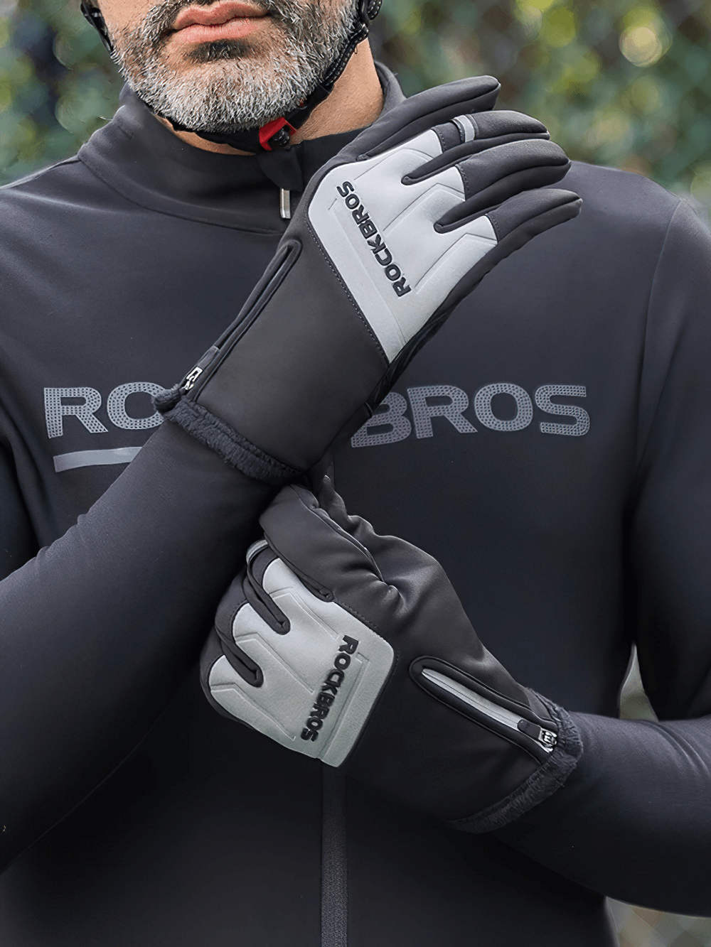 Cyclist wearing touchscreen anti-slip winter cycling gloves with zipper fit, SF2621 model, for cold-weather rides.