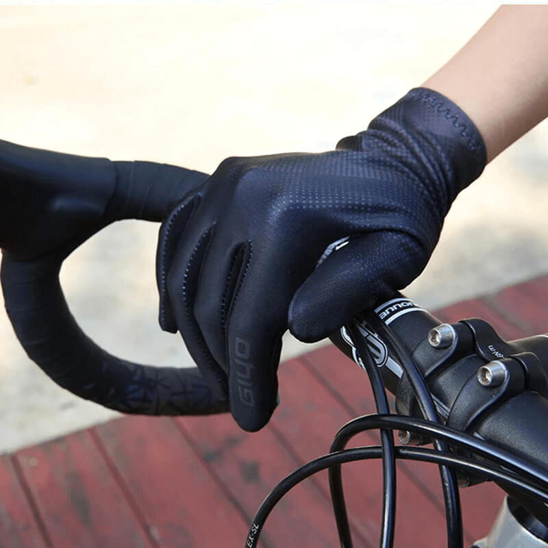 Cycling touchscreen full fingers gloves for men and women gripping handlebars, showcasing breathable and anti-slip features.