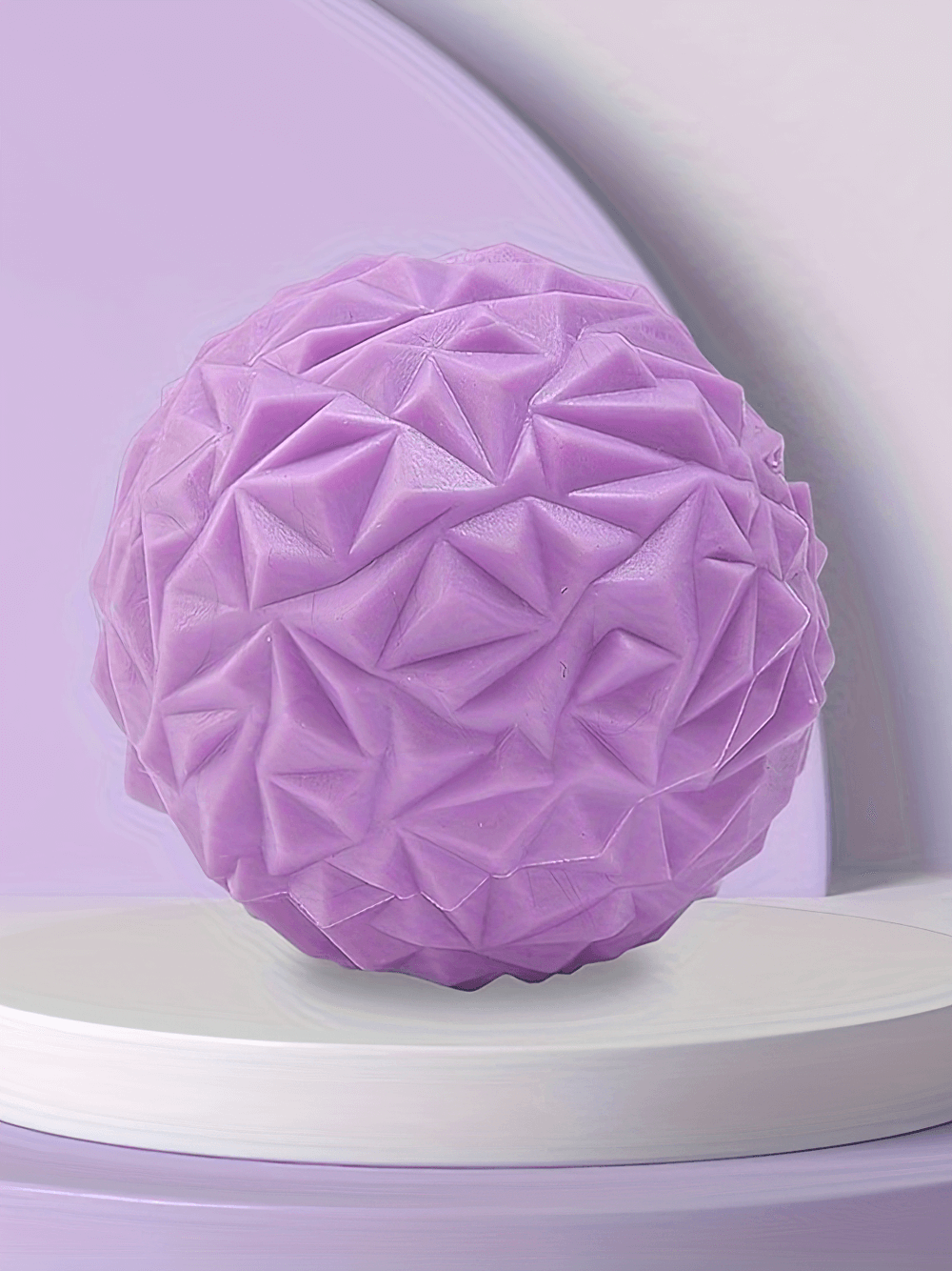 Purple textured deep tissue massage ball for foot and muscle relief, ideal for reflexology and myofascial release.