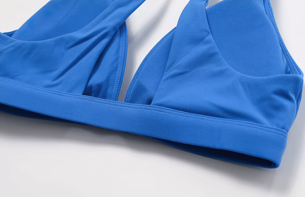Blue deep V-neck padded sports bra for fitness, yoga, and running, featuring breathable, quick-dry fabric and shockproof design.