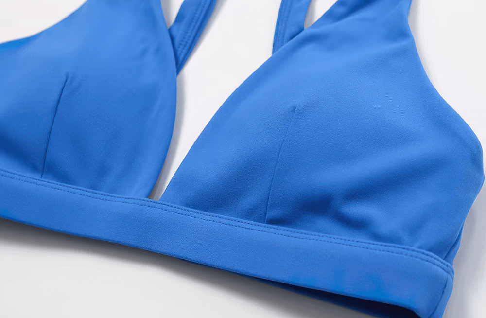 Close-up of blue deep V-neck padded sports bra, ideal for fitness, yoga, and running with shockproof, breathable design.