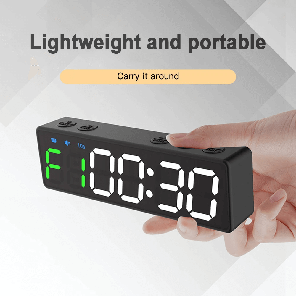 Hand holding a lightweight digital countdown clock with LED display, showcasing portable design for gym workouts and fitness.