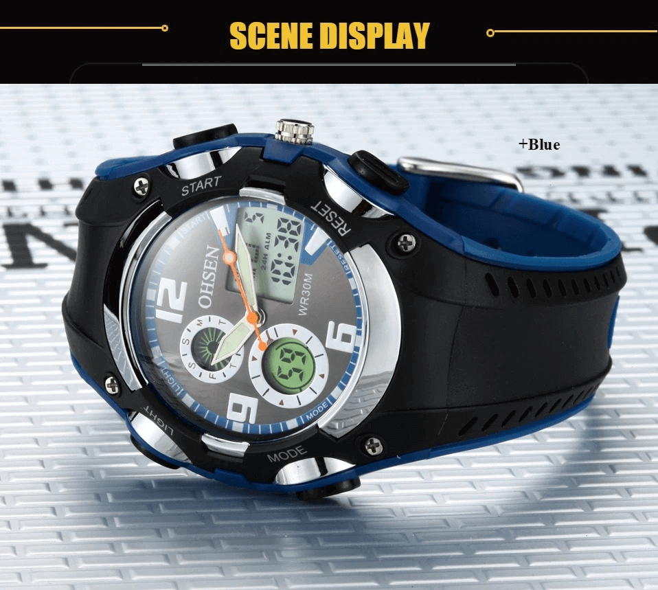 Digital quartz wristwatch with blue silicone band, black bezel, and LED display on a textured surface.