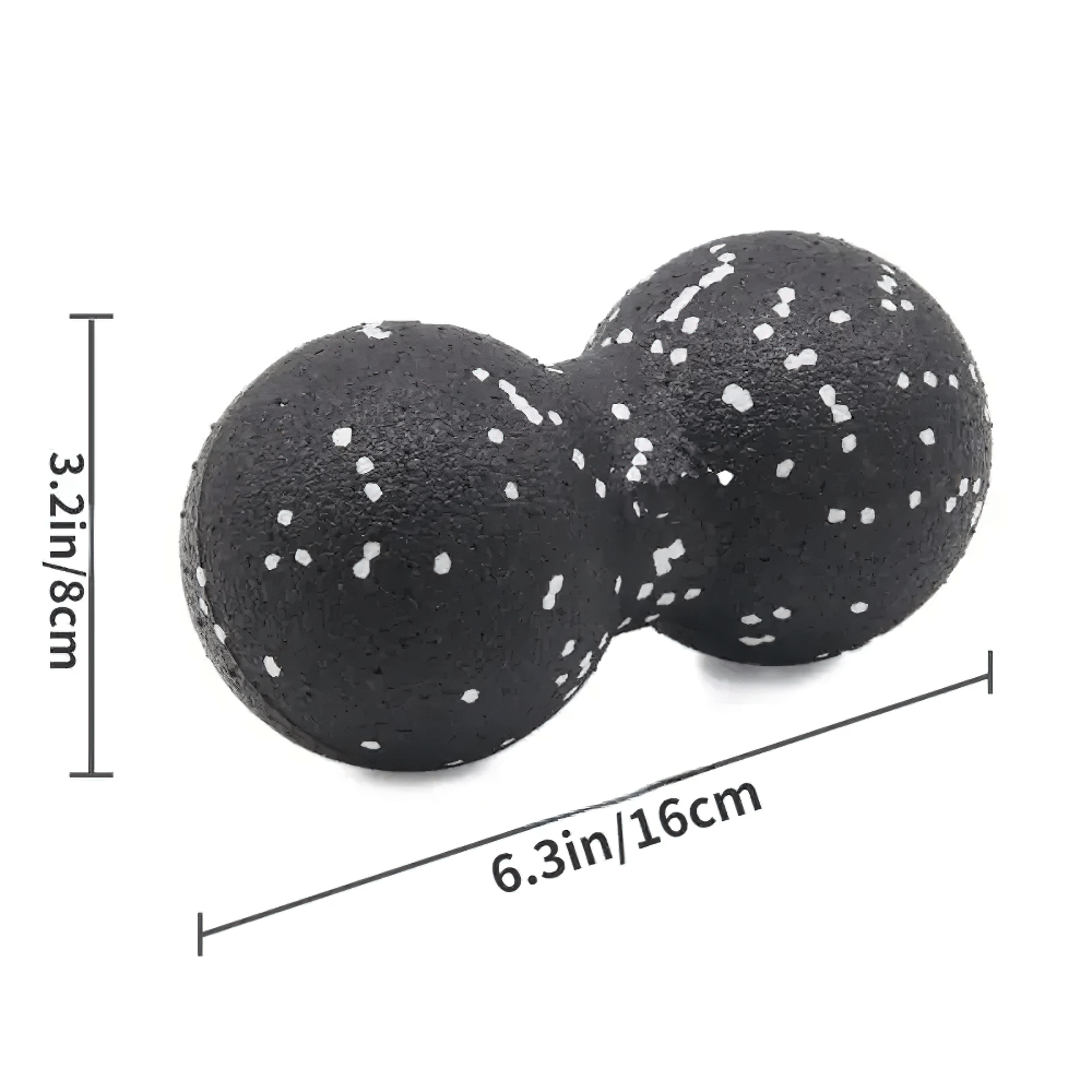 Black double-sided massage ball with white speckles, measuring 6.3 inches by 3.2 inches, designed for muscle pain relief.