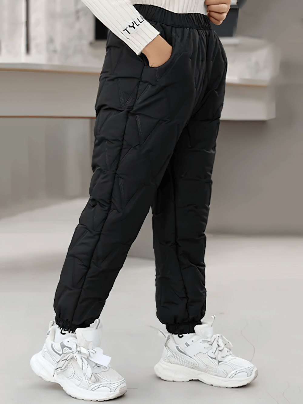 Child wearing Down Pants Warm Padded Ski and Snow Trousers - SF3733, black color, perfect for winter sports and outdoor play.