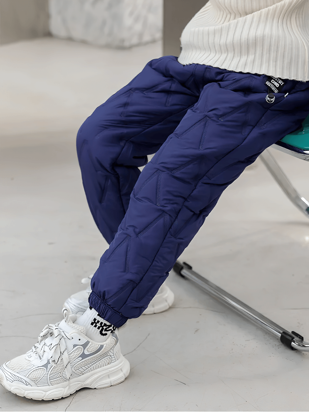 Child wearing Down Pants Warm Padded Ski and Snow Trousers - SF3733 in blue for winter adventures.