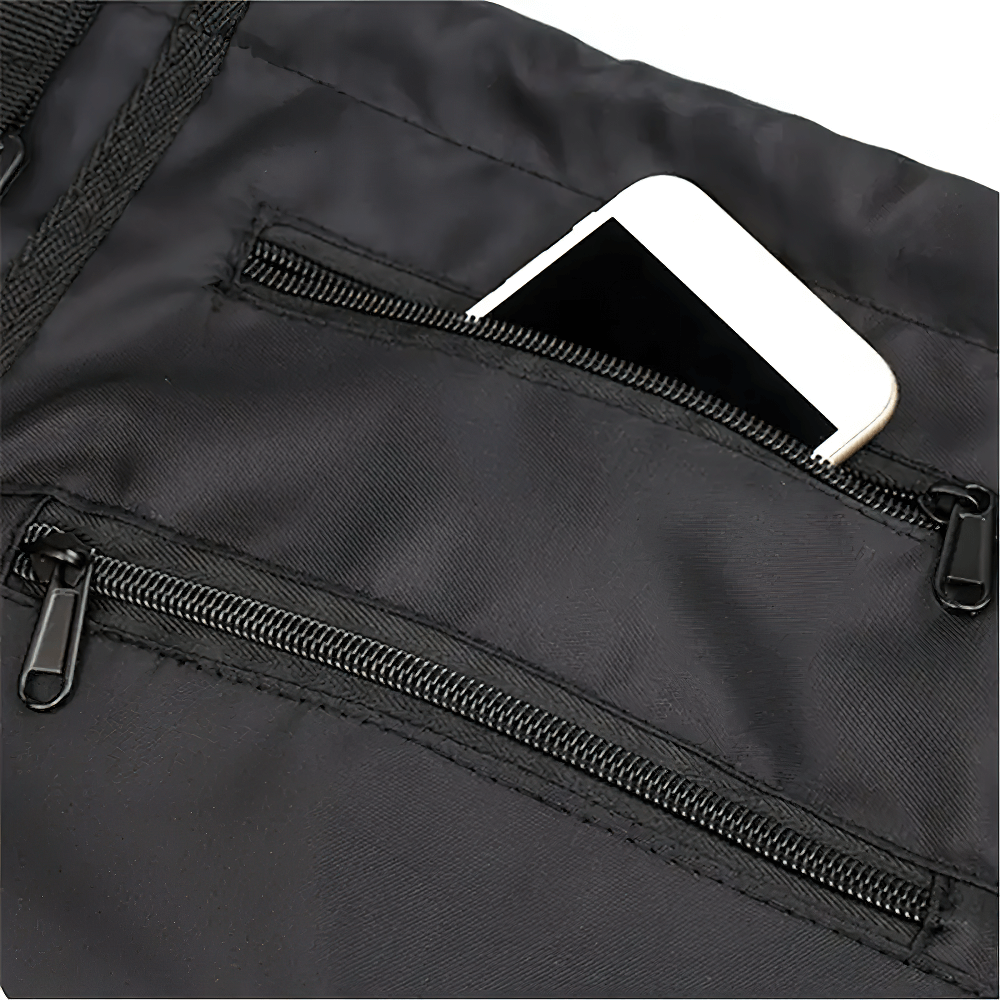 Close-up of drawstring backpack with phone in zippered pocket, showcasing durable nylon material and convenient storage for gym or sports gear.