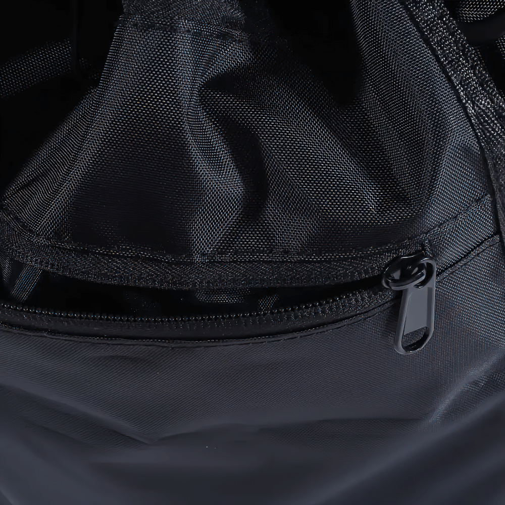 Close-up of black drawstring backpack with zipper and mesh pockets, ideal for gym and sports equipment storage.