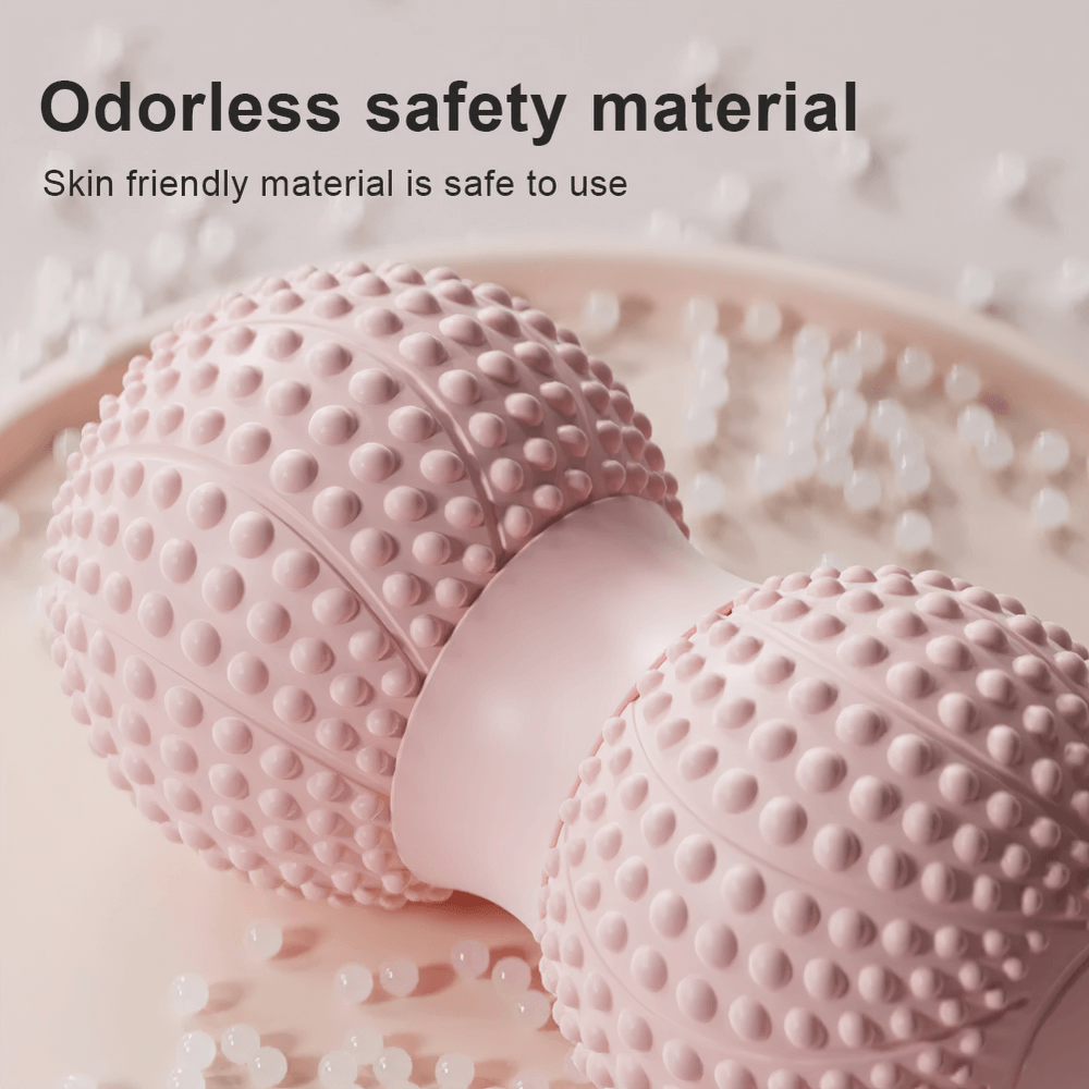 Close-up of pink dual-sided massage roller with textured surface for muscle relaxation, highlighting odorless, skin-friendly material.