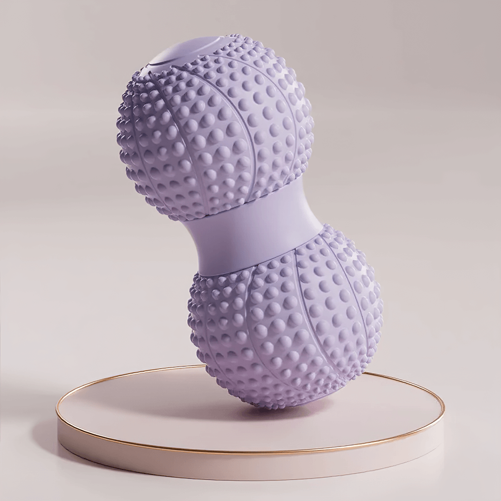 Purple dual-sided massage roller for muscle relaxation and therapy, perfect for foot, arm, and back massage on a display stand.