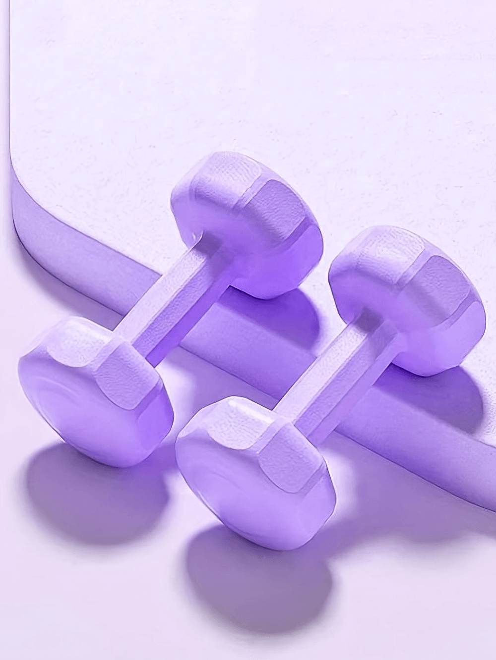 Vibrant purple dumbbell set, 2-pack 4.4lb weights for workouts, perfect for yoga and strength training at home or gym.