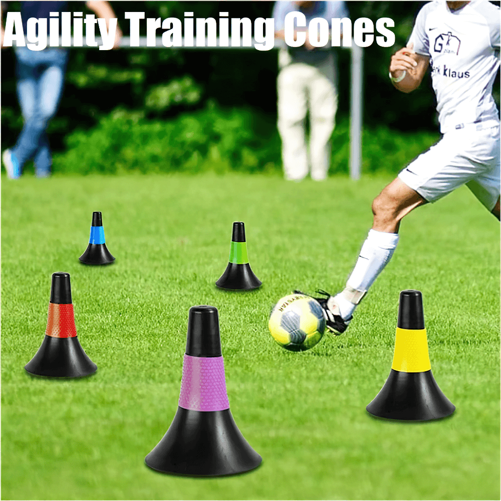Football player training with colorful agility cones on grass field, enhancing speed and footwork in outdoor drills.