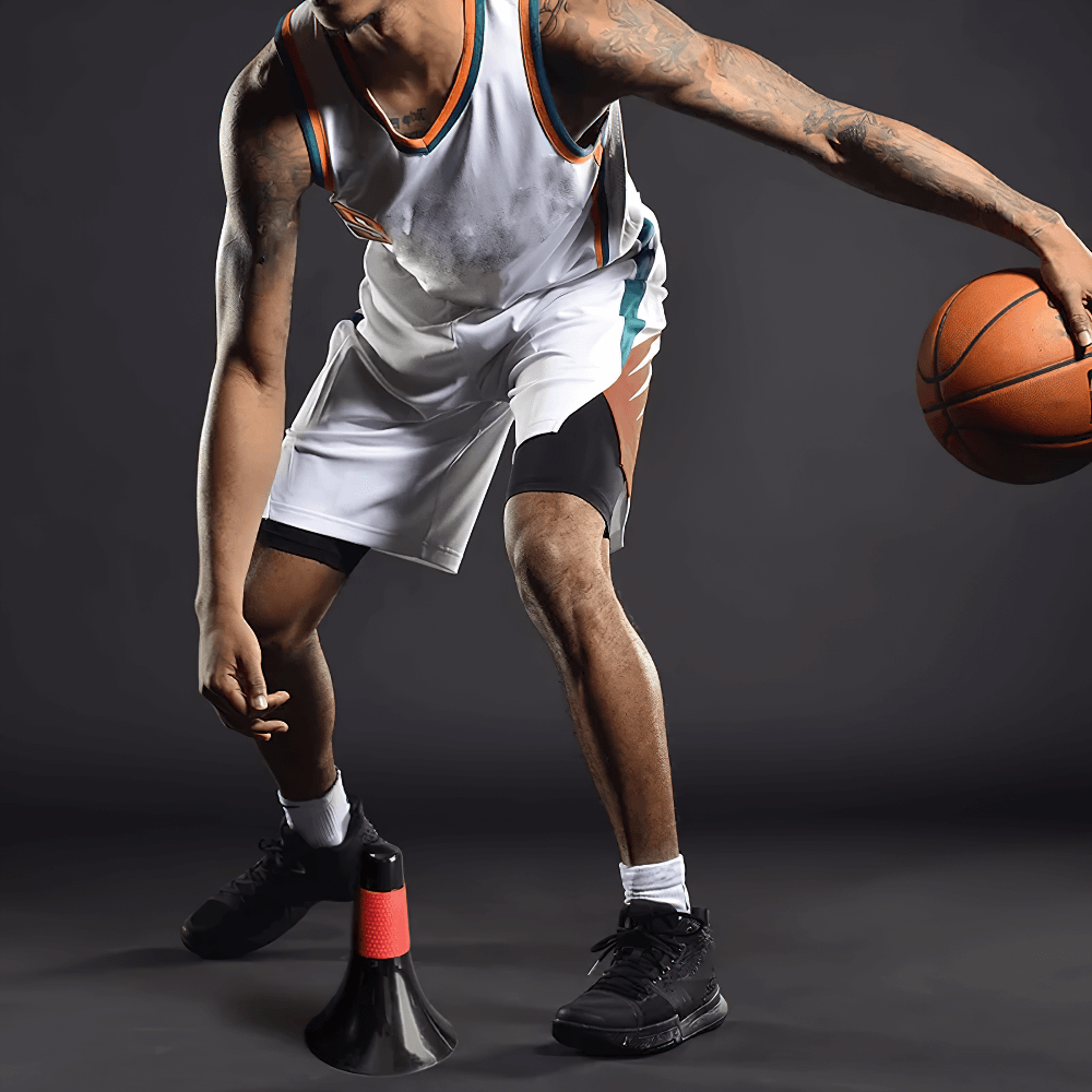 Agility speed cone used in basketball footwork training indoors with player in action improving quick movements.