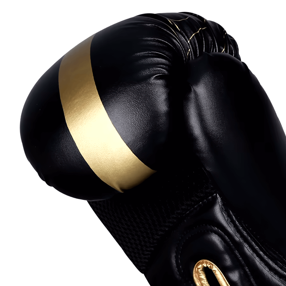 Close-up of SF2685 black and gold PU leather boxing gloves with wrist support and breathable mesh for training.