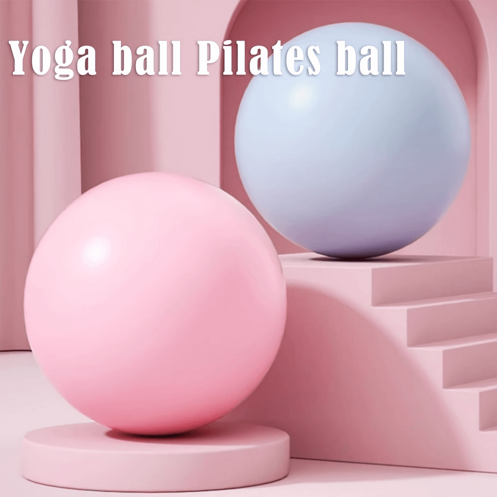 Two colorful Pilates spheres on a pastel staircase, perfect for yoga and balance exercises.