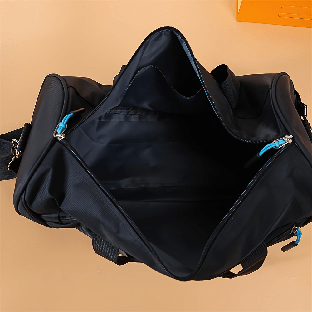 Spacious interior of black durable sports duffel bag with secure zipper closures and versatile carry options for gym and travel.