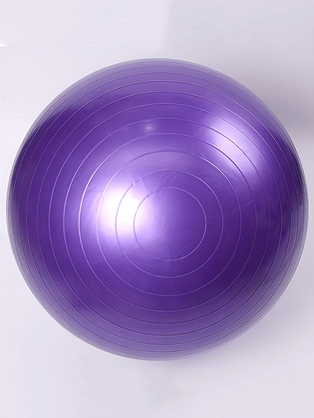 Purple durable yoga ball with anti-burst design for core and stability workouts, ideal for Pilates, strength, and balance exercises.