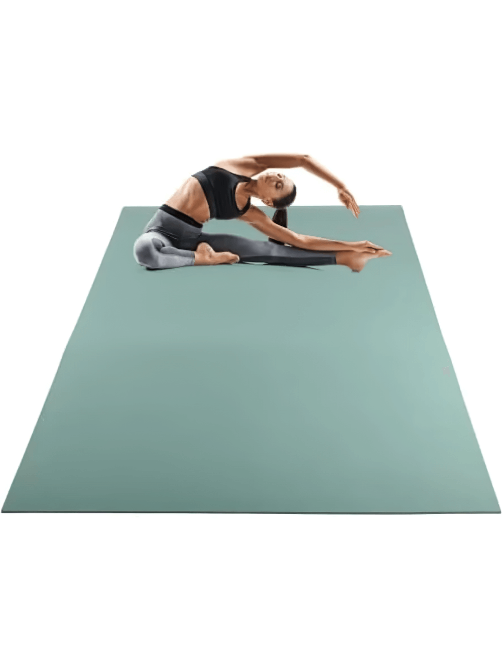 Woman doing yoga on eco-friendly non-slip extra-wide PVC yoga mat, 8mm thick and textured for comfort, in a serene pose.