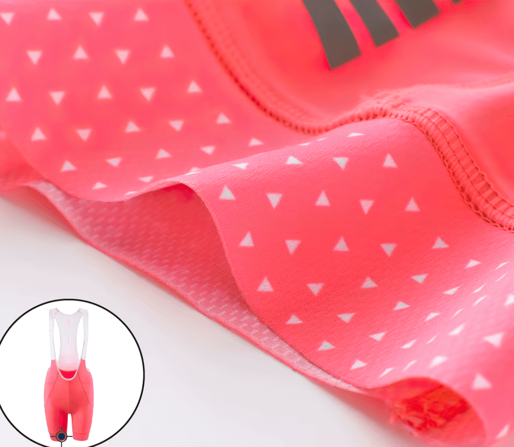 Close-up of fluorescent women's cycling bib shorts SF2581, featuring breathable fabric and ergonomic design for style and comfort on rides.