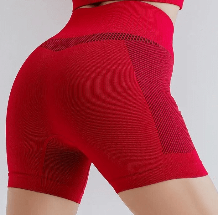 Red elastic breathable high-waisted women's shorts, perfect for yoga or running, showcasing flexible and comfortable fit.