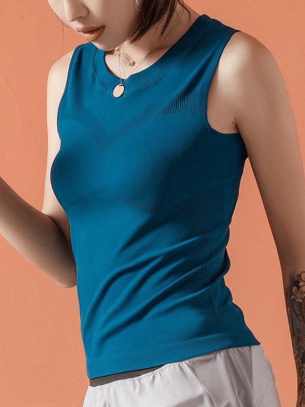 Elastic Breathable Women's Tank Top for Training in blue, ideal for workouts, yoga, or running. Model wearing slim fit tank top.