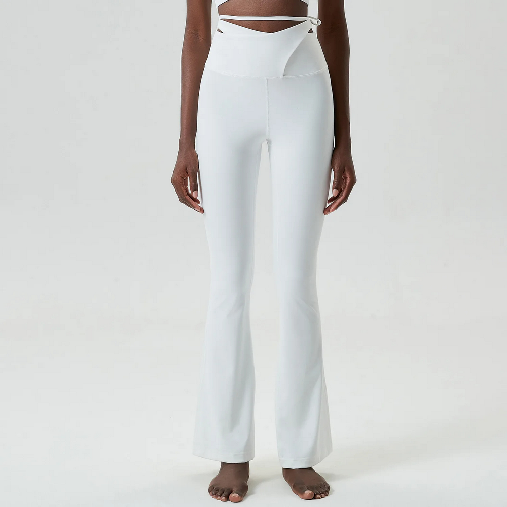 Stylish emerald bell bottom yoga pants with tie-up detail, perfect for fashion-forward fitness enthusiasts and everyday wear.