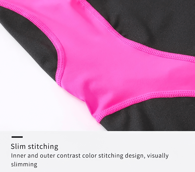 Close-up of pink and black patchwork design on high-waisted sports shorts showcasing slim stitching detail, visually slimming.