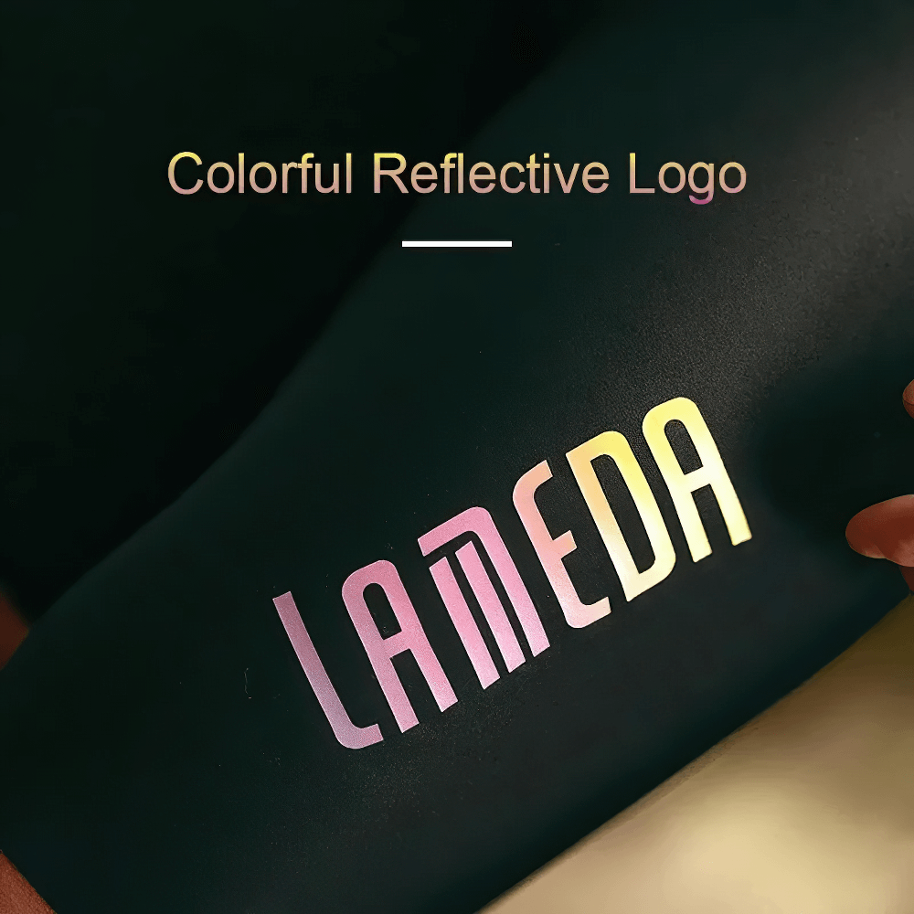 Close-up of colorful reflective logo on black fabric with the word 'LAMEDA' in vibrant colors.