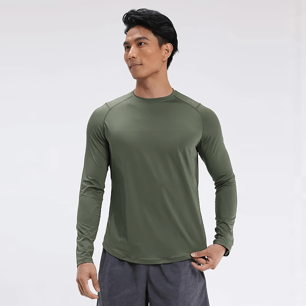 Man wearing green elastic quick-dry long sleeve sports top for running and fitness, featuring breathable and lightweight design.