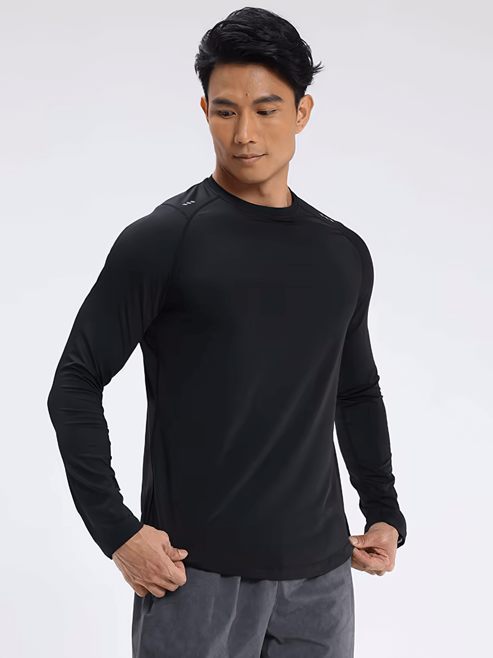 Alt Tag: Man wearing Elastic Men's Long Sleeves Sports Top for Running, perfect for gym and fitness, crafted from quick-dry polyester.