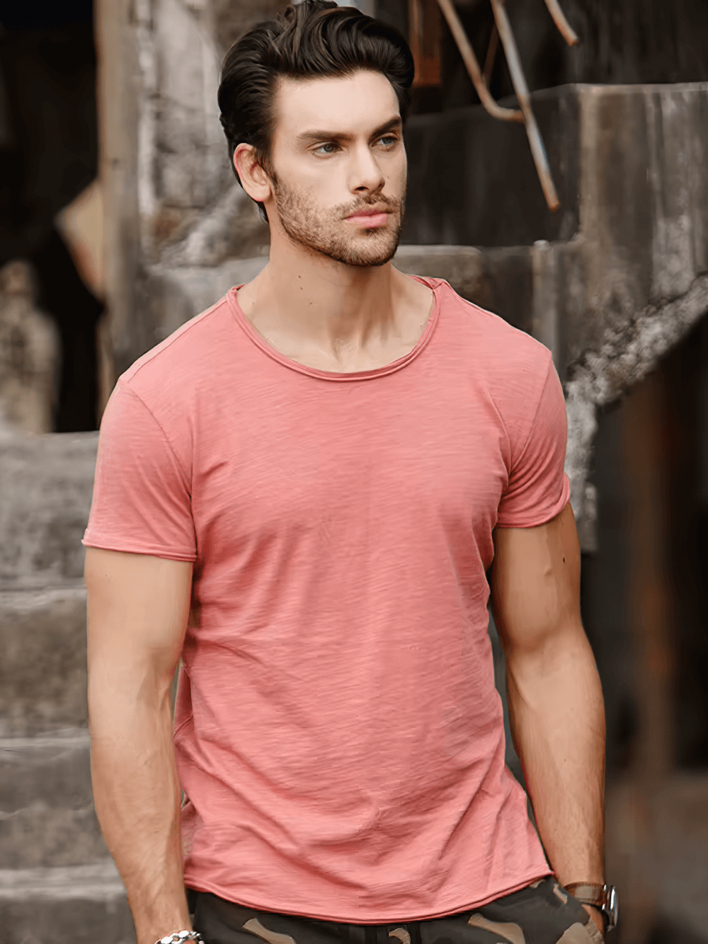 Model wearing an elastic men's sport T-shirt with short sleeves, featuring a casual soft fitness style and O-neck in pink.