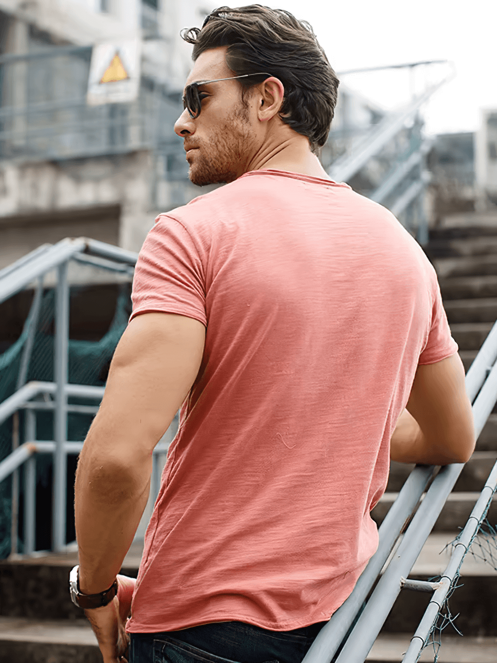 Man wearing Elastic Men's Sport T-Shirt SF2530, in casual outdoor setting, highlighting short sleeves and breathable fabric for fitness.