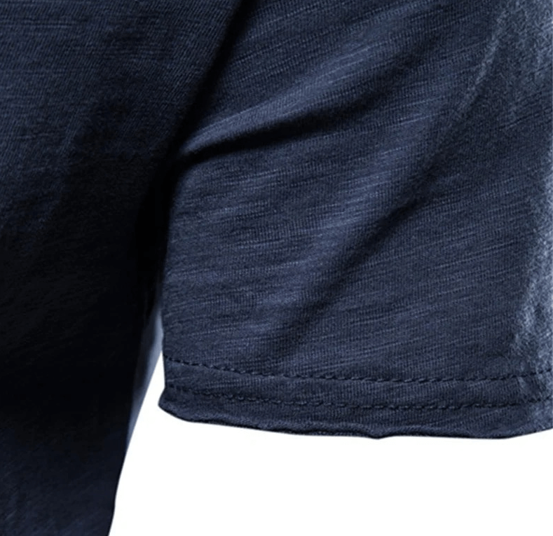 Close-up of blue men's athletic short sleeve T-shirt, showcasing breathable cotton fabric and detailed stitching for casual or sport wear.