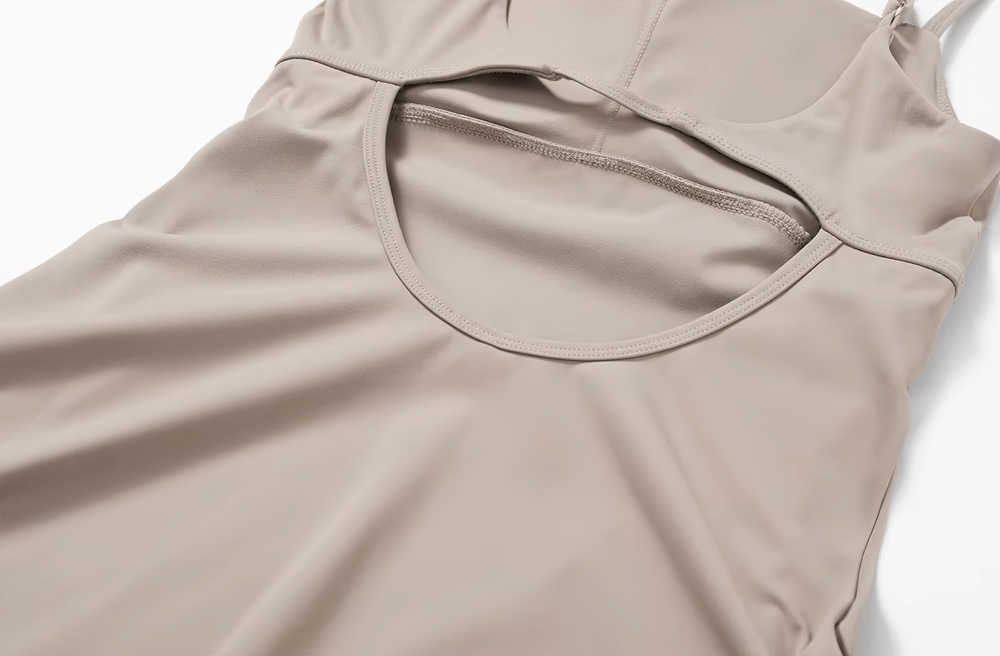 Close-up of beige Elastic One-Piece Sports Yoga Dress for Women - SF2373, featuring breathable nylon fabric suitable for active wear.