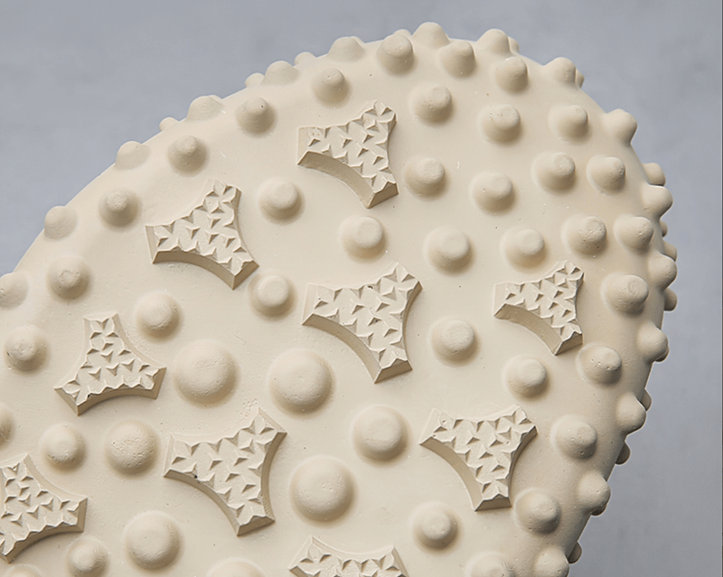 Close-up of textured rubber outsole on men's hiking sandals, highlighting grip and durability of Elastic Soles Leather design.