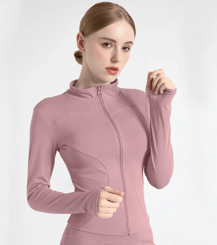 Woman wearing pink Elastic Sports Jacket with zipper and finger holes.