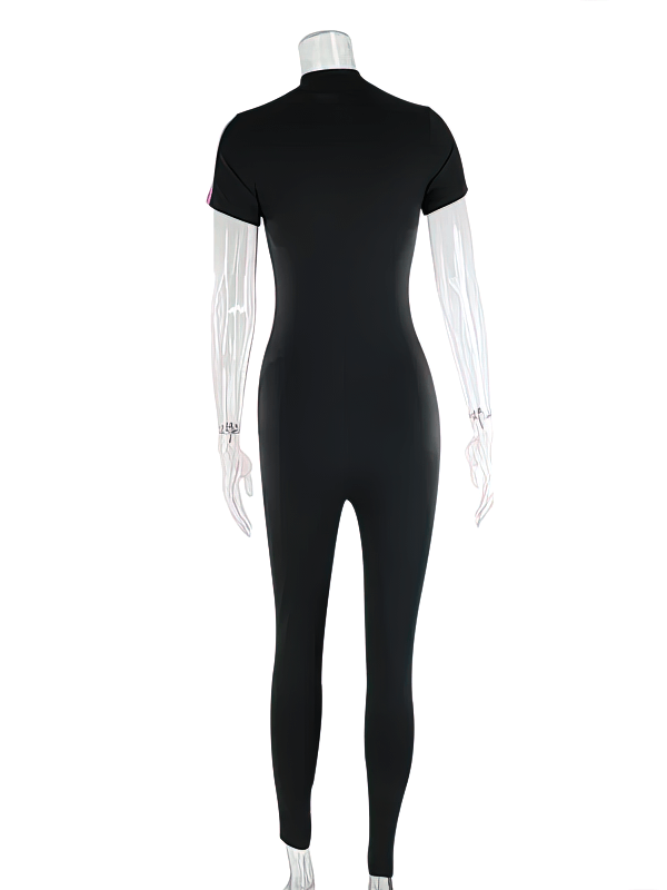 Back view of black elastic sports jumpsuit for women with short sleeves. Ideal for yoga and workouts. Polyester and spandex fabric.