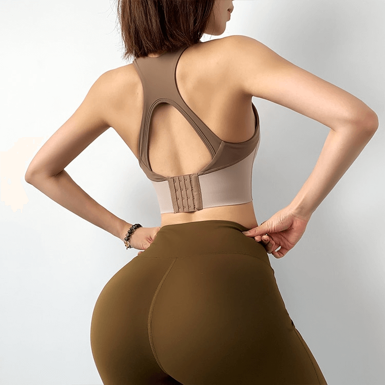 Back view of a woman wearing a brown Elastic Support Women's Sports Bra SF1299, perfect for training and fitness activities.