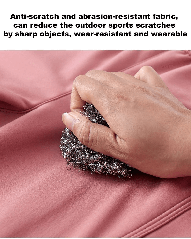 Testing the toughness of anti-scratch, abrasion-resistant outdoor pants fabric with a metal brush for durability demonstration.