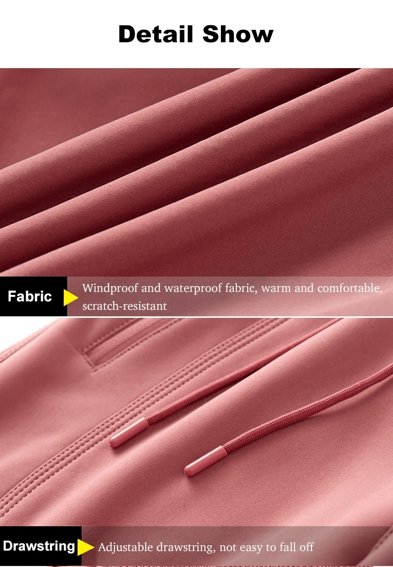 Close-up of red outdoor pants showing windproof, waterproof fabric and adjustable drawstring for secure fit.