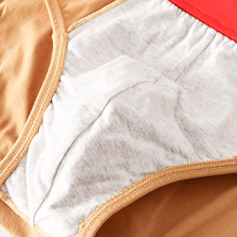 Close-up of elastic waist solid color cotton men's briefs showcasing breathable fabric and stitching details.