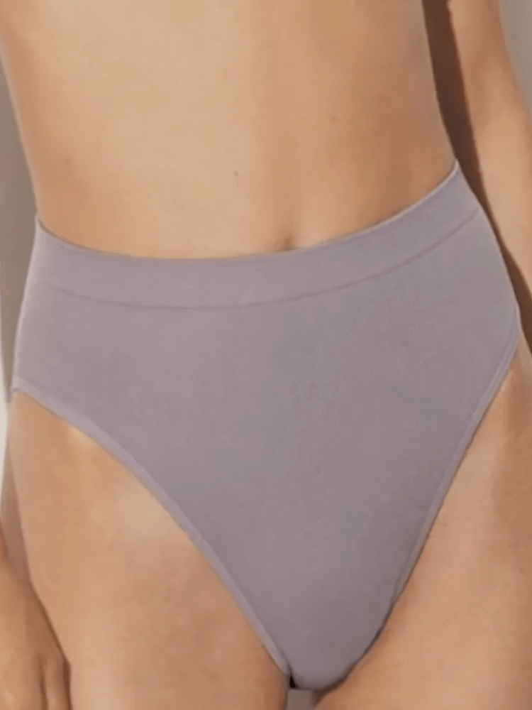 Elegant high-rise seamless women's briefs in lavender, made from breathable cotton-spandex blend, designed for everyday comfort.