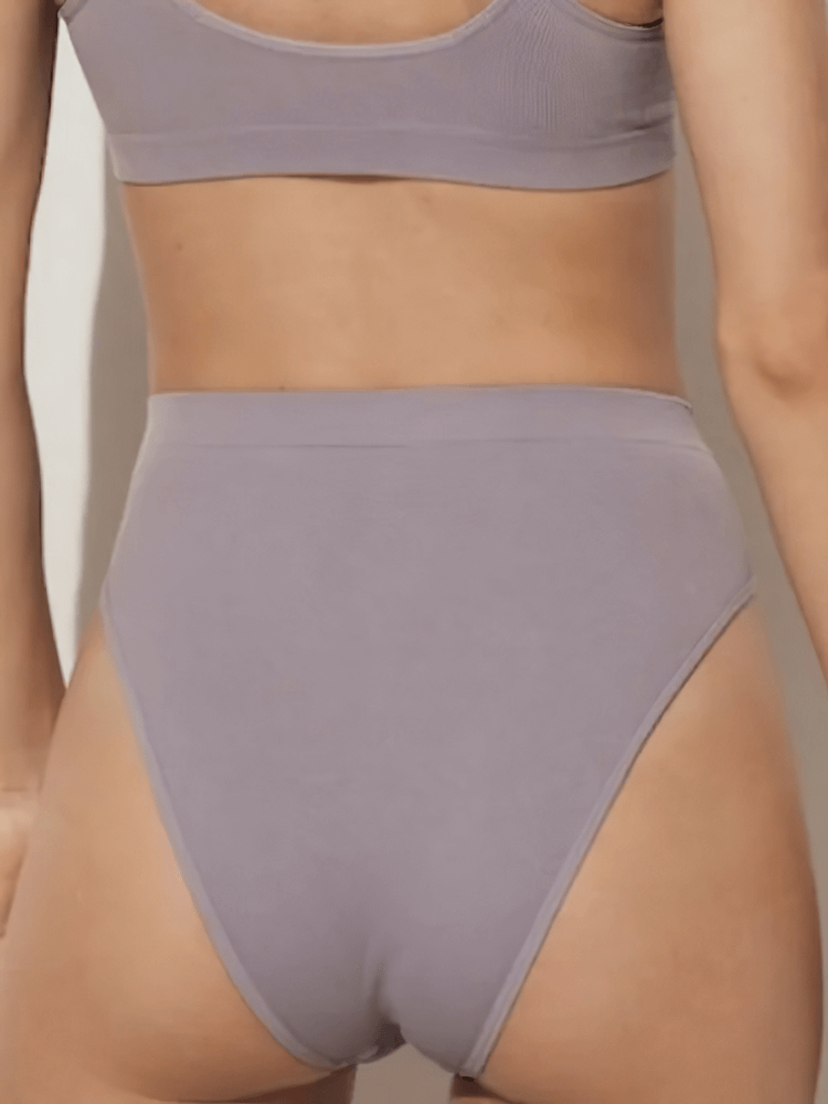 Rear view of high-waist solid color women's briefs in soft cotton blend, offering seamless fit and comfort for daily wear.