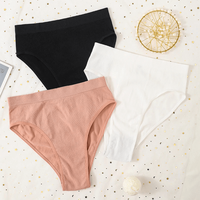 Three elastic high waist women's briefs in black, white, and blush pink, showcasing solid colors and breathable cotton-spandex blend.