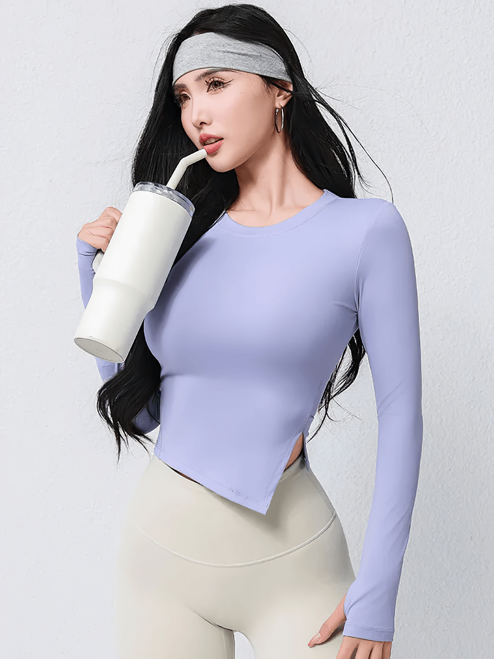 Woman wearing Elastic Women Long Sleeve Breathable Workout Top - SF4196, sipping from a cup