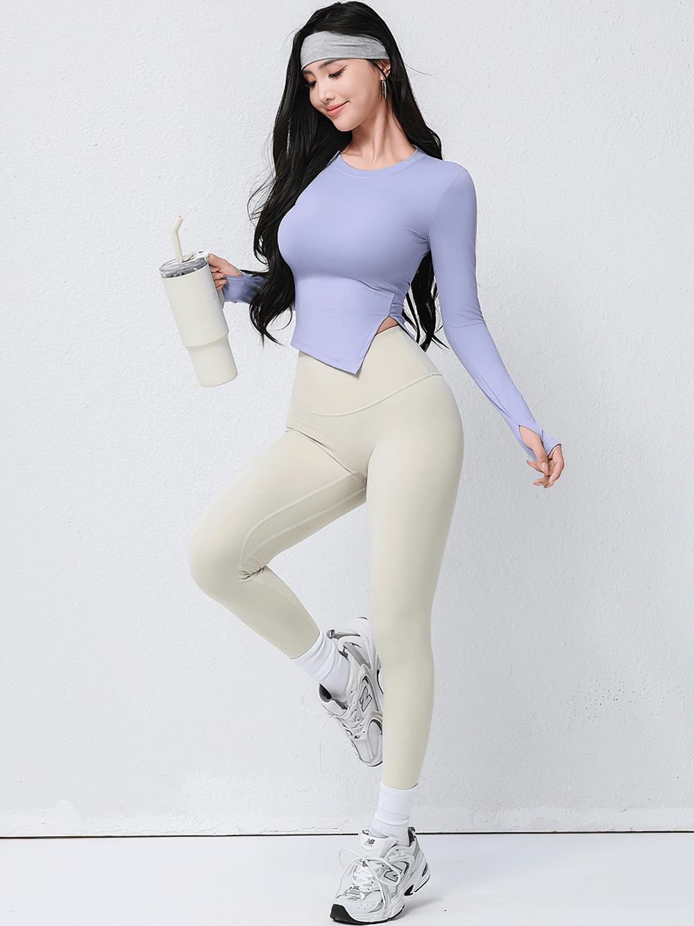Woman wearing Elastic Women Long Sleeve Breathable Workout Top - SF4196 in lavender, holding a fitness shaker, styled for yoga or active wear.