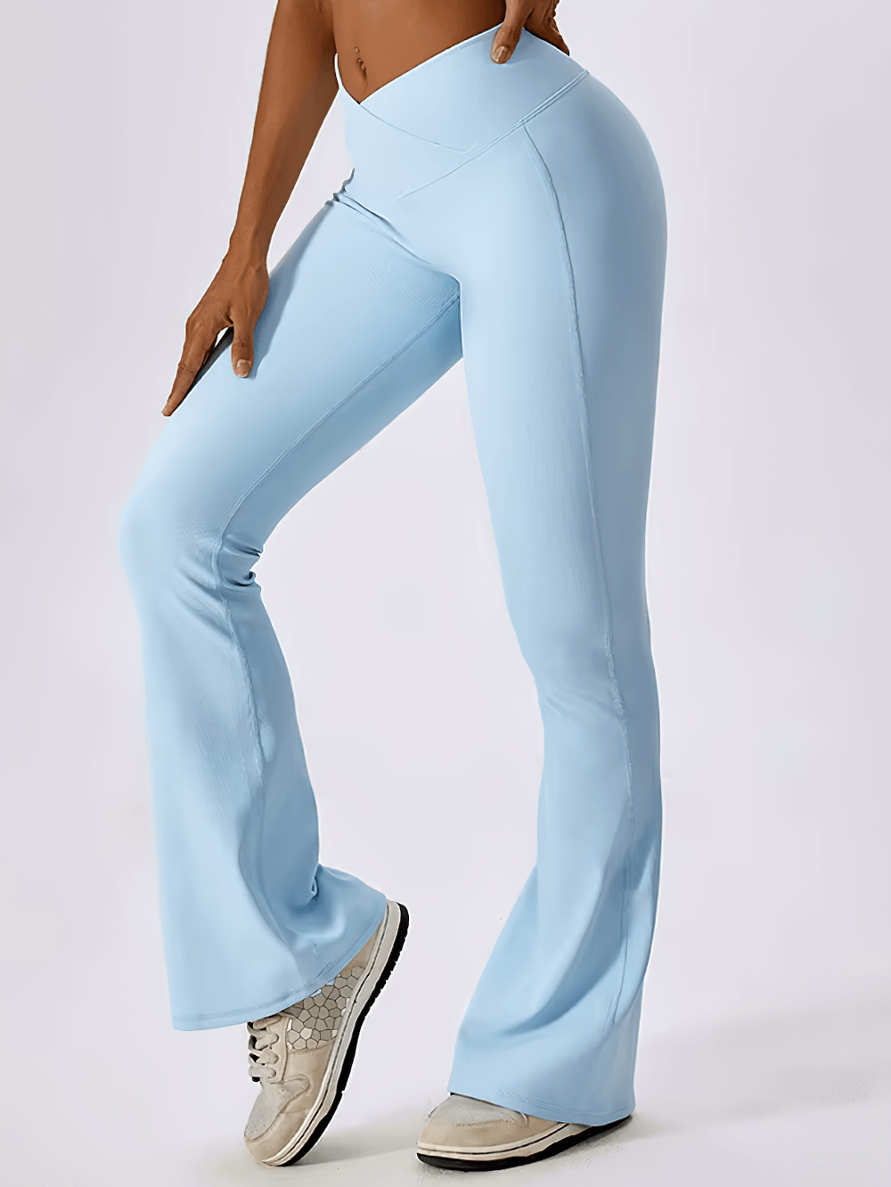 Light blue high waist flared yoga pants for women, showcasing breathable and stretchy material, perfect for workouts and style.