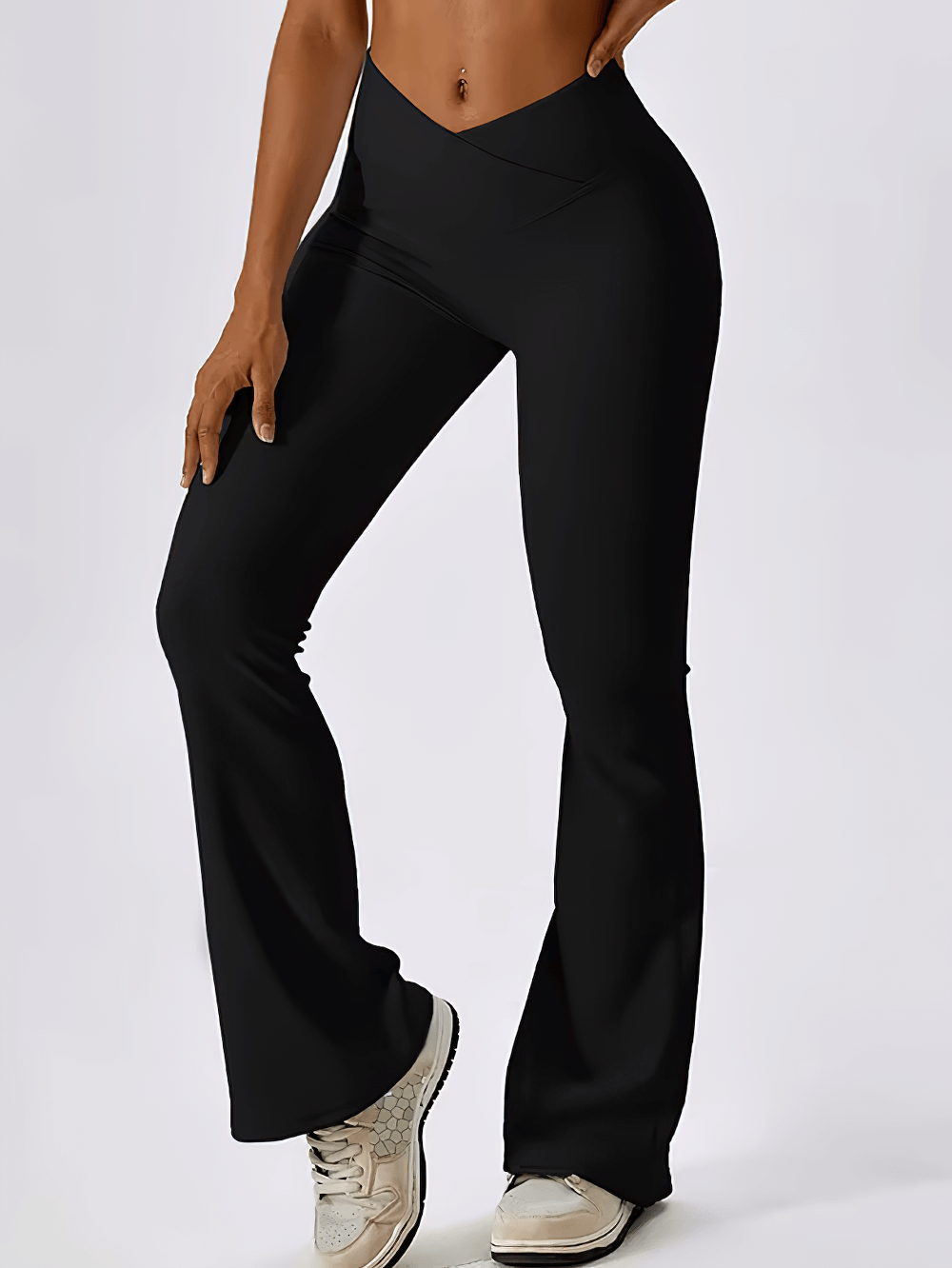 Woman wearing black high-waist flared yoga pants SF2352, showcasing flexible flare leggings perfect for yoga, running, and dancing.