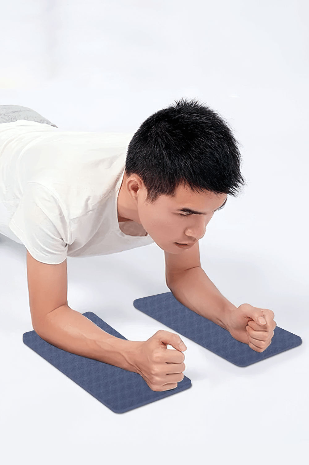 Man using embossed portable elbow mats for planking, demonstrating stability and wrist support during exercise with SF3409 mats.